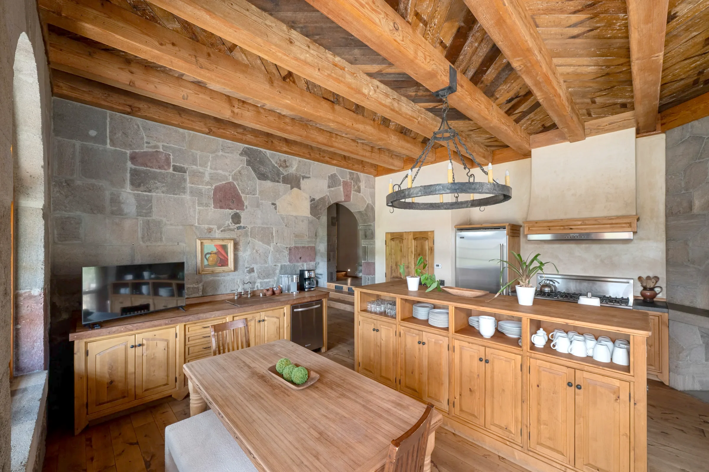 The kitchen at Stonewood Estate, timber beams and stone walls
